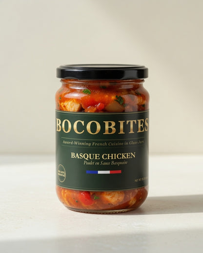 Jar of Bocobites Basque Chicken on a white surface with a neutral background